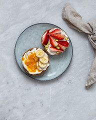Fruit sandwiches with vegan ricotta cheese on marble background. view from above with copy space