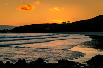 Sunset caravan silhouette Van life concept Traveling Europe. Camper on beach. Freedom concept....