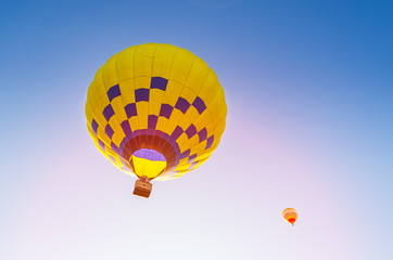 Colorful hot air balloon flying in the blue sky