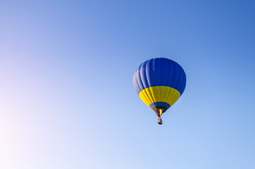 Colorful hot air balloon flying in the blue sky