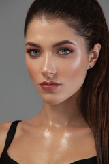 Fototapeta premium Closeup portrait of beautiful young woman with clean and fresh skin. Nude makeup. Concept for cosmetology ads with copy space, beauty magazine and spa.