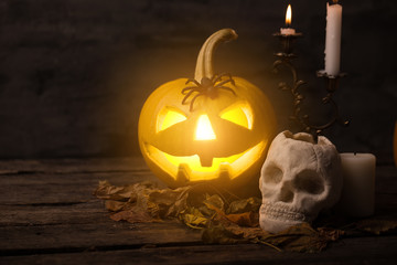 Scary halloween pumpkin with skull in a spooky night. Halloween scene.