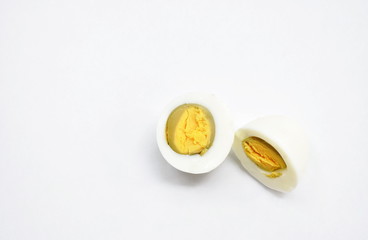 boiled egg and yolk half cut on white background