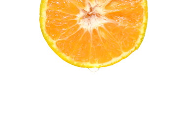 water dropping on tangerine orange half cut in white background