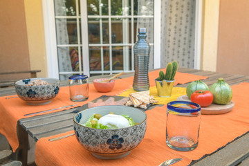 Balanced diet, cooking, culinary and food concept - close up of vegetables, cheese and fish on wooden table