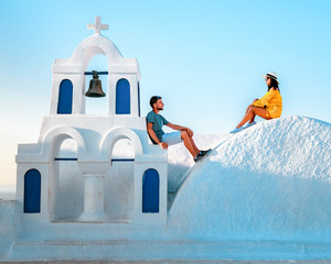 young couple on vacation in Santorini Greece, luxury holliday vacation Oia Santorini Greece