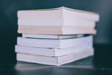 selecting which books to keep and which to discard or donate, decluttering concept