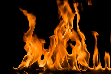 Fire flame on black background. Blaze fire flame textured background.