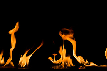 Fire flame on black background. Blaze fire flame textured background.