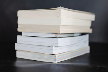 selecting which books to keep and which to discard or donate, decluttering concept
