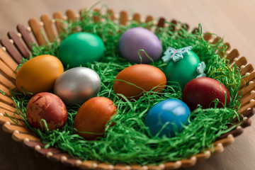Colorful easter eggs in basket
