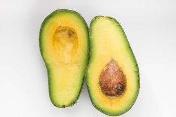 Slice of avocado on white background