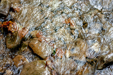 Wet stone pebbles in the river. Pebble and colored pebbles in the water. Stones, Water, Wave, Nature, Pebble, Wet. River water stone