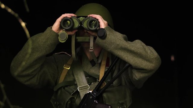 A soldier with boniculars
