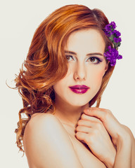 Redhead girl with flower, isolated.