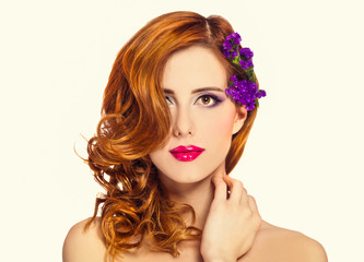 Redhead girl with flower, isolated.