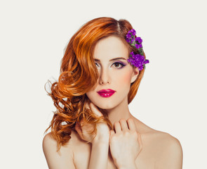 Redhead girl with flower, isolated.