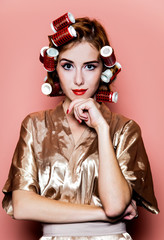Redhead girl with curlers