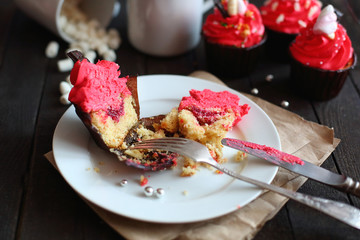 cupcakes with red cream on grey background