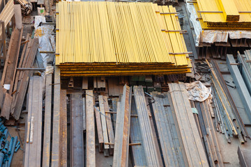Steel piles and construction equipment that are placed inside the site. Construction work
