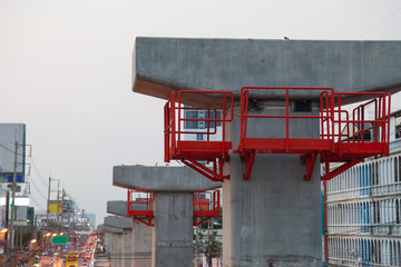 Concrete pillars that are being rebuilt for sky train travel