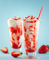 Strawberry milkshake with whipped cream.