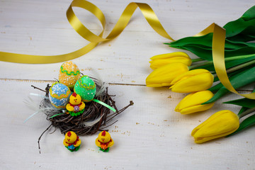 Easter eggs. Happy easter card. Multi-colored Easter eggs. Easter. Easter eggs on a white wooden...