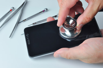 Smartphone and stethoscope. Diagnostic, repair and service.