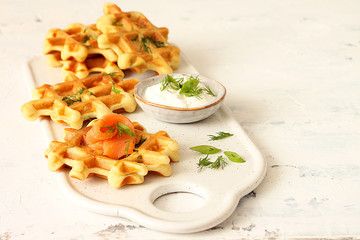 Waffles with fresh herbs and salmon