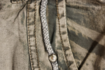 clothing items washed cotton fabric texture with seams, clasps, buttons and rivets