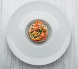 Close up photograph of a plate of spinach salad