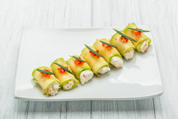 grilled zucchini with tomato, arugula and mozzarella cheese, drizzled with olive oil and balsamic vinegar