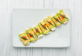 grilled zucchini with tomato, arugula and mozzarella cheese, drizzled with olive oil and balsamic vinegar