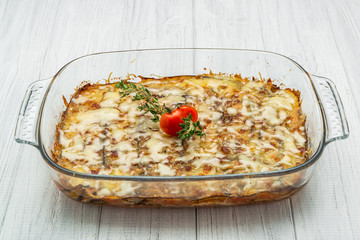 Hot tasty lasagna in ceramic casserole dish