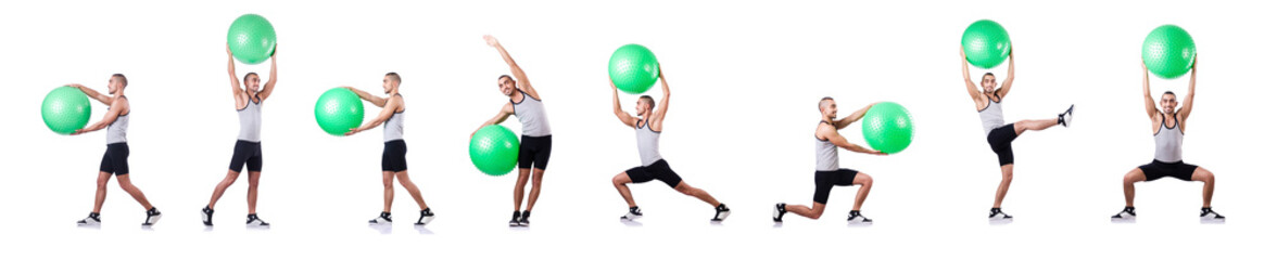 Man with swiss ball doing exercises on white
