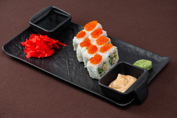 sushi on a black plate