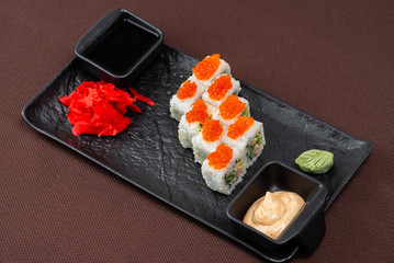 sushi on a black plate