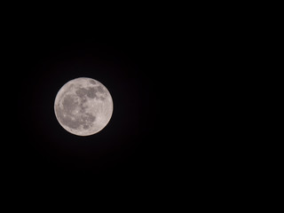 Full moon in the night sky with copyspace.