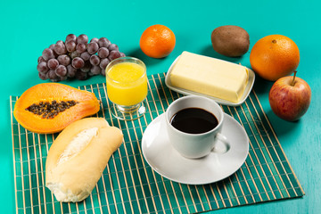 Breakfast with coffee, fruit and bread.