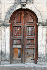 Fototapeta na wymiar Old vintage wooden brown door entrance