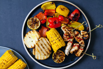 Grilled chicken skewers with peppers and sweetcorn