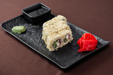 sushi on a black plate