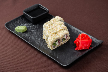 sushi on a black plate