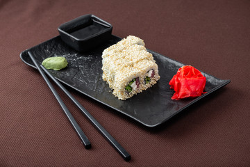 sushi on a black plate