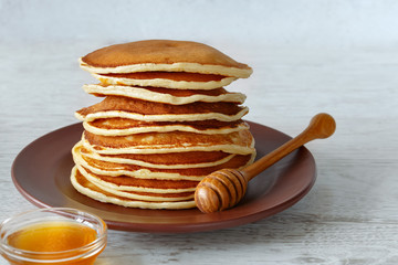 Stack of pancakes in a plate on the table