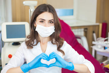 Young woman in cosmetological parlor. Dermatologist in beauty parlor. Doctor in the clinic. Closeup portrait of dermatologist.