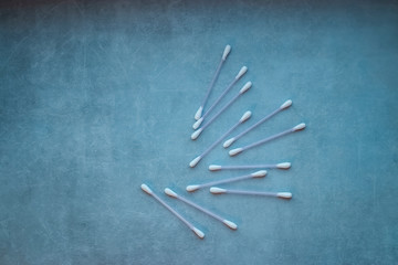 Cotton buds on gray background. Copy space.
