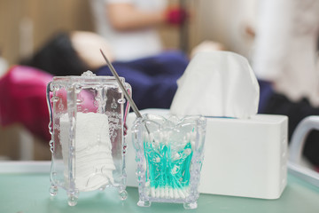 Hands in gloves making disinfection for manicure and cosmetology tools. Sterilization process in the clinic or salon.