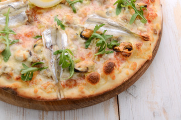 Delicious spicy Italian food, pizza with anchovies and gherkins, hot piquant meals for foodie