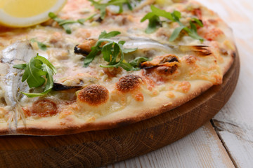 Delicious spicy Italian food, pizza with anchovies and gherkins, hot piquant meals for foodie